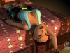 Lara Croft reclining on a bed